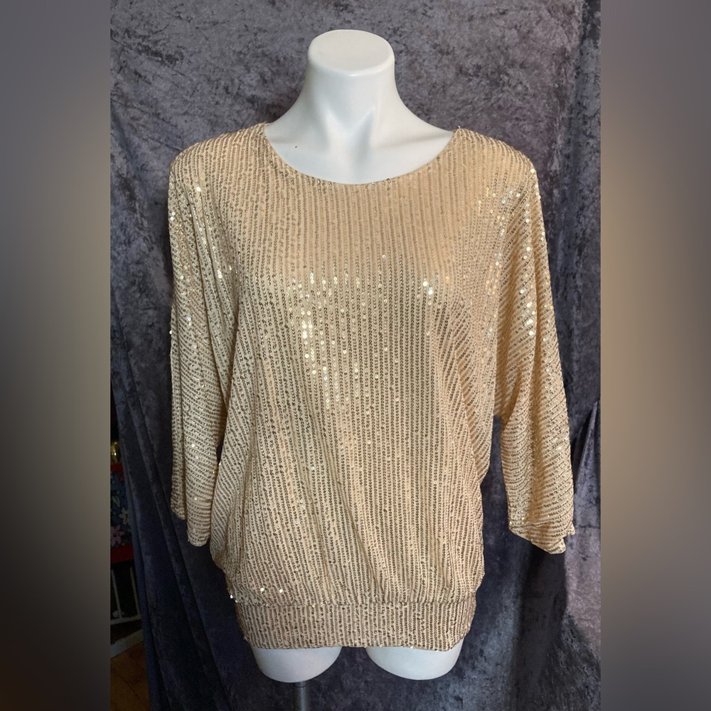 Sparkly, sequined cold-shoulder style shirt